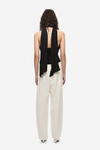 Black silk halter top back view, open-back with vertical center strap