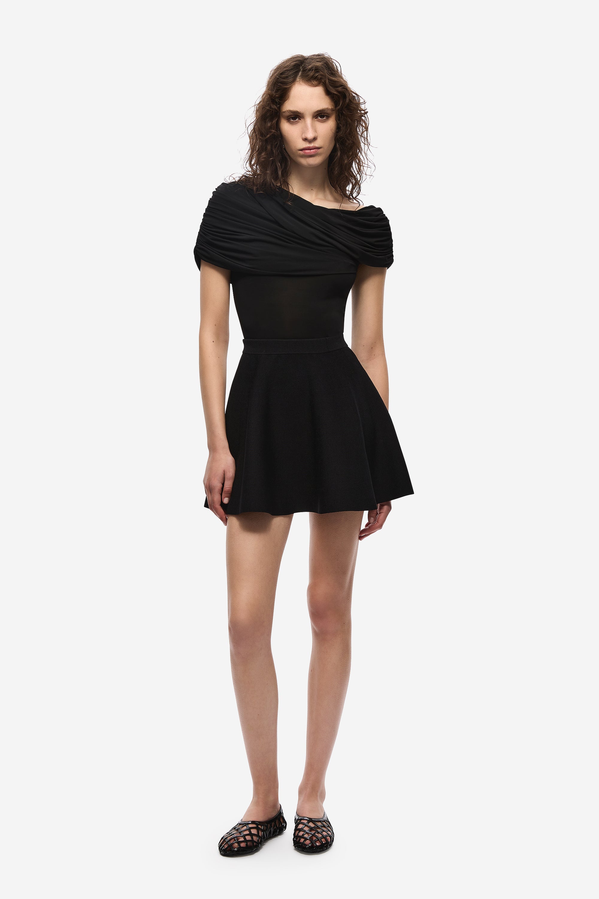 Black cowl-neck jersey top with short sleeves and flared hem