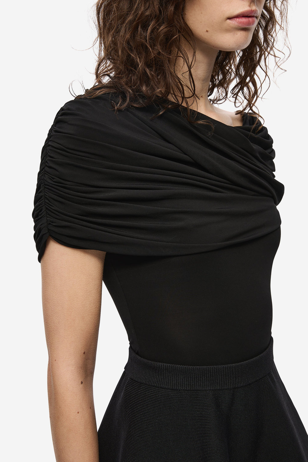 Black jersey top with draped cowl neckline and short sleeves
