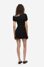 Black jersey top with back draped cowl detail and short flared hem