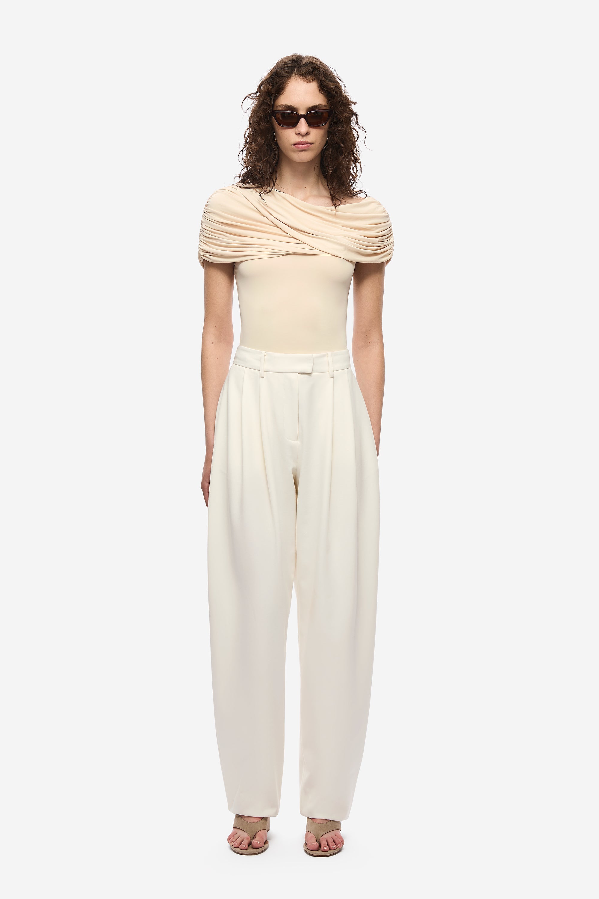 Cream draped cowl off-shoulder jersey top with short sleeves and gathered front.