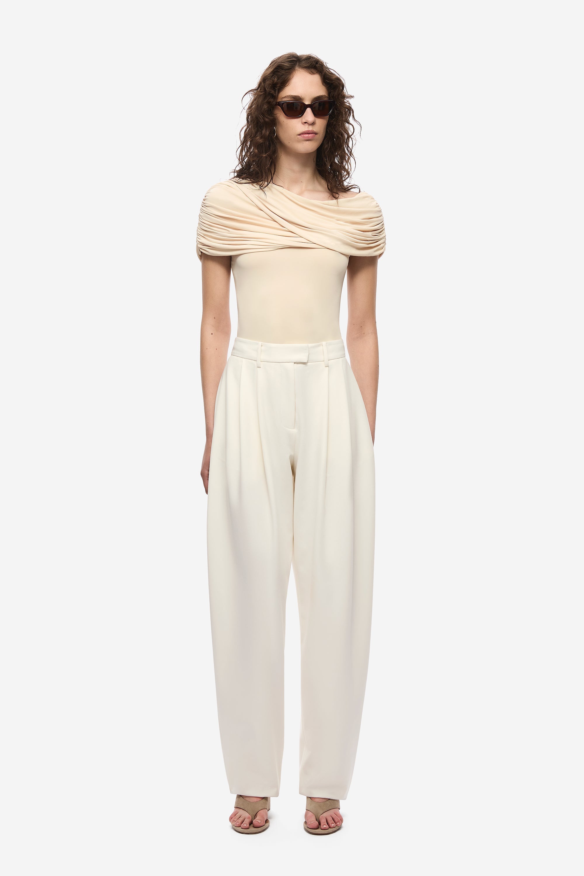 Pearl ivory jersey top with off-shoulder cowl drape, fitted short sleeves, front view.