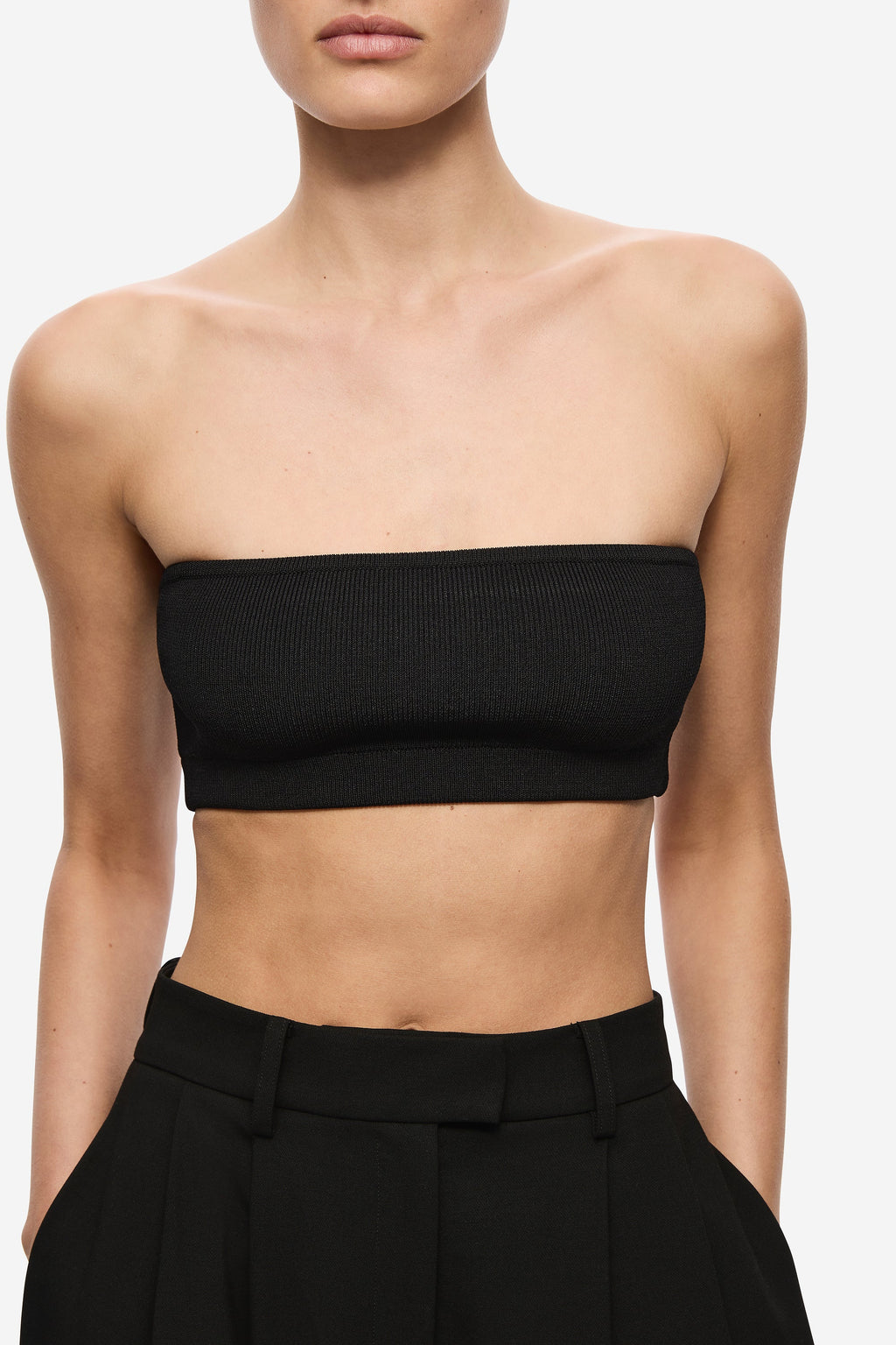 Black strapless bandeau knit top, fitted cropped length