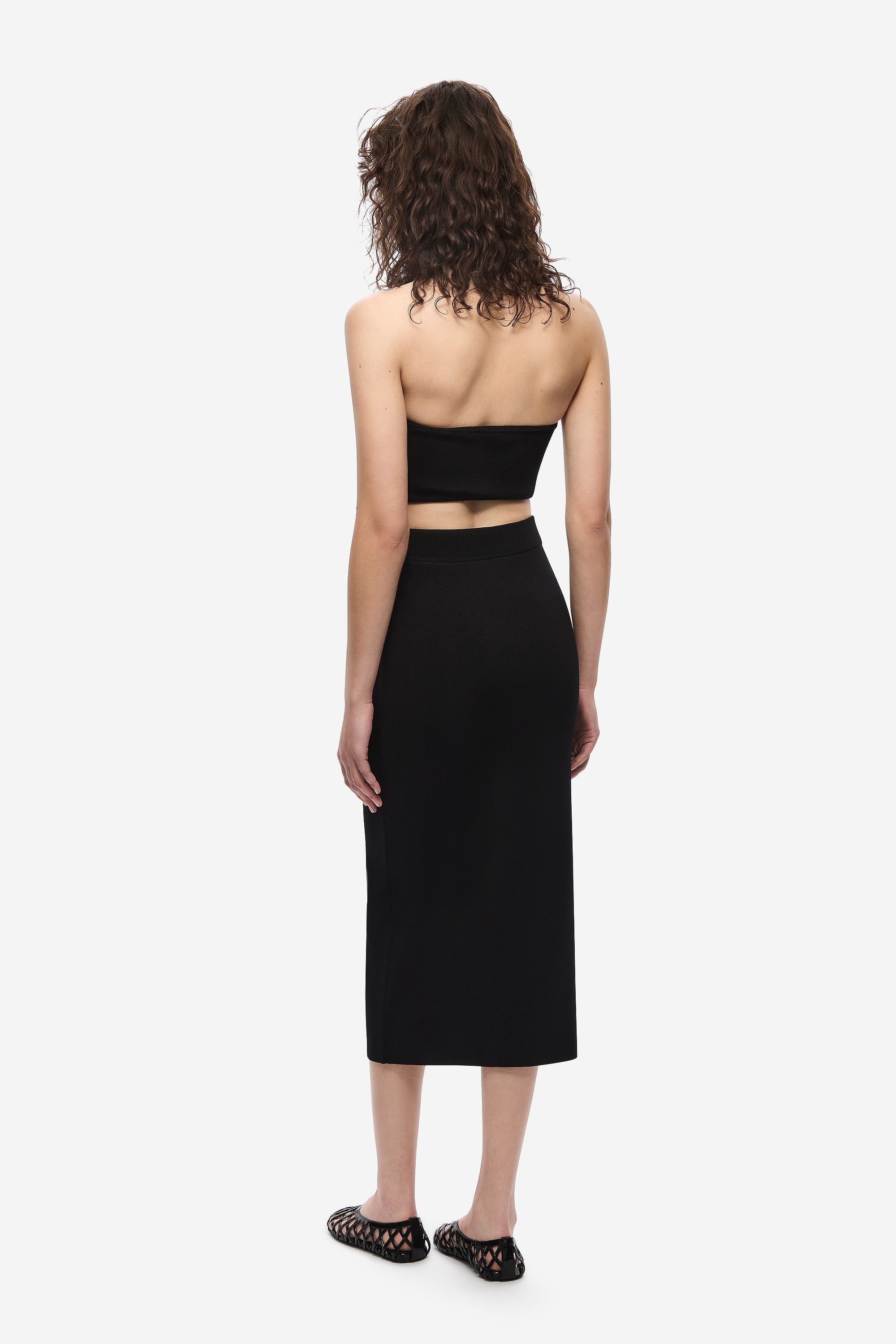 Black knit column midi skirt, back view