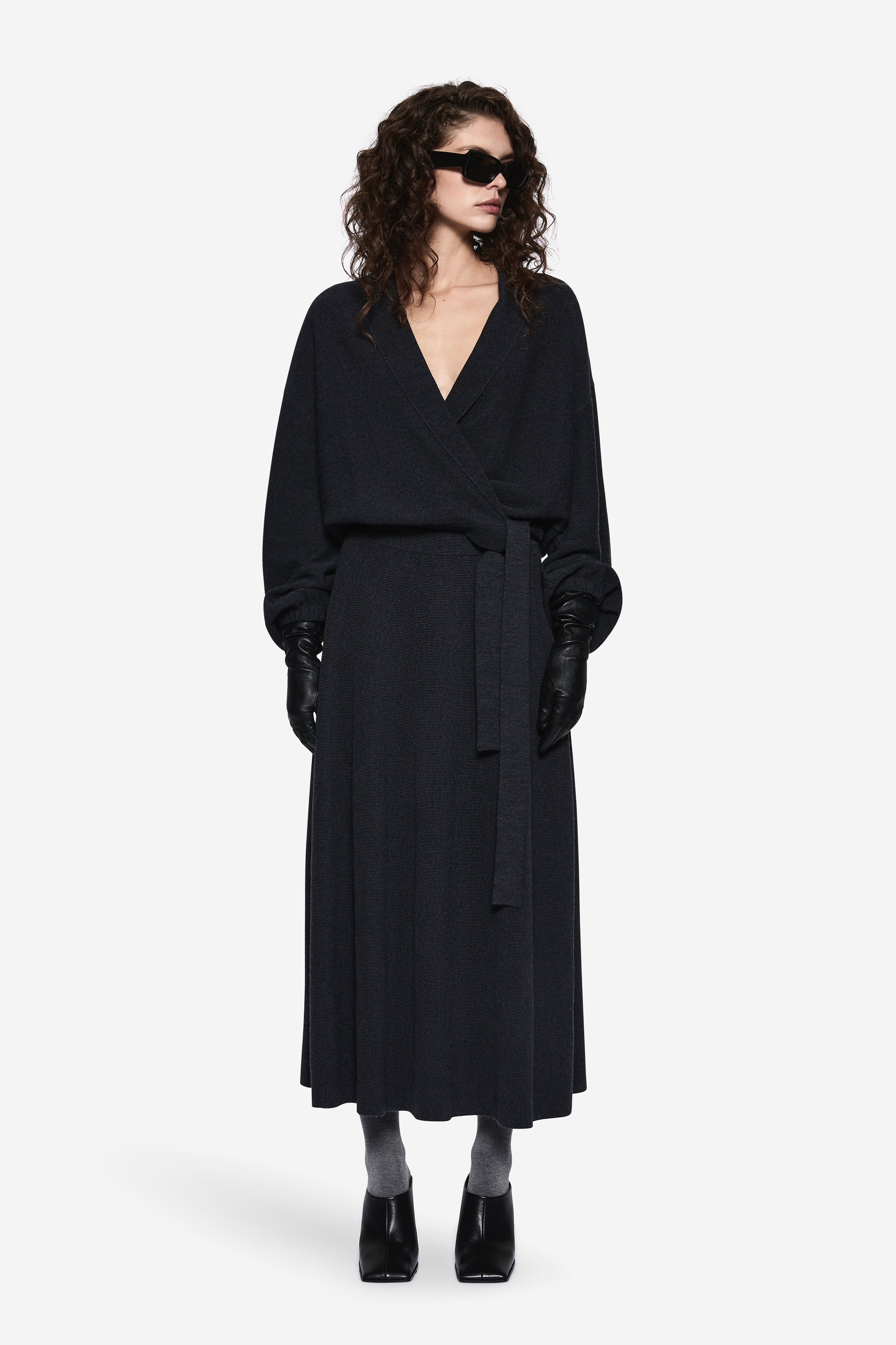Dark charcoal wrap cardigan with V-neck, long sleeves, and adjustable waist tie.