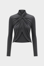 Dark charcoal TENCEL long-sleeve twist top with knotted collar and curved hem.