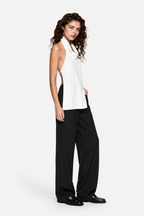 Ivory silk apron-style halter top with draped front and sleeveless cut