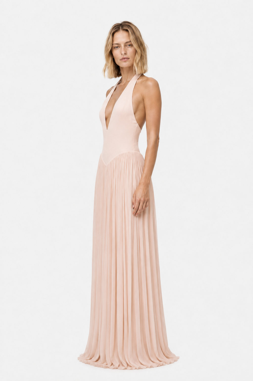 Soft pink sleeveless jersey maxi dress with deep V neckline and flowing pleated skirt