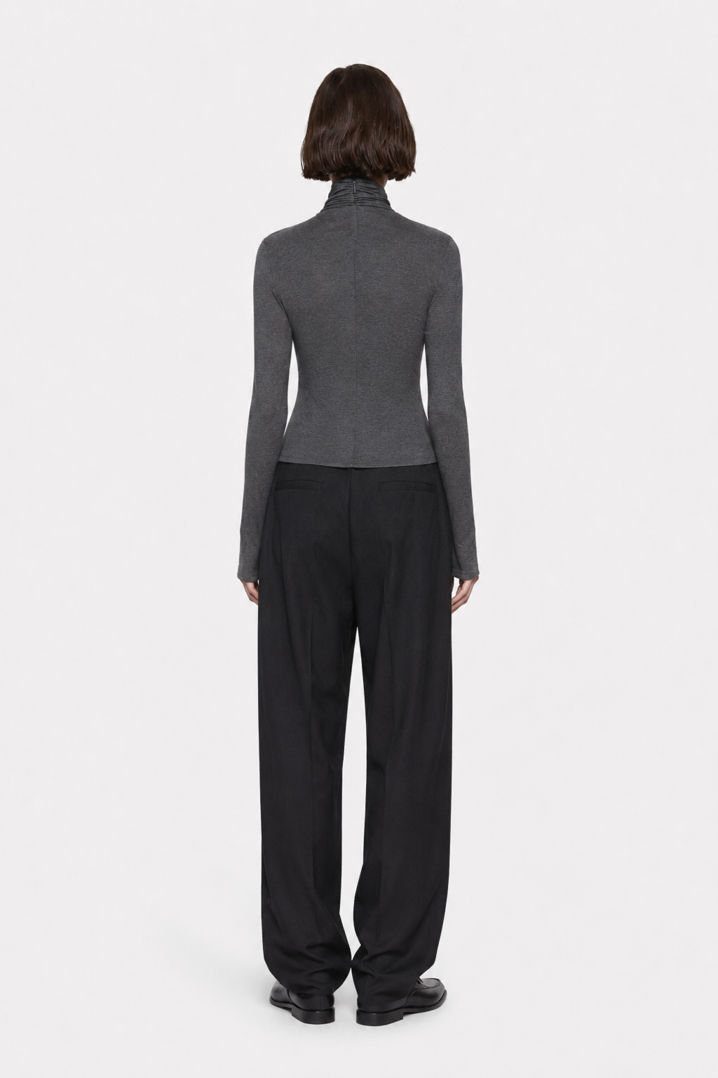 Dark charcoal TENCEL long-sleeve twist top, back view with gathered high neck.