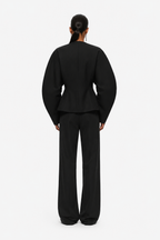 Black blazer jacket back view with V-neck seam and long sleeves
