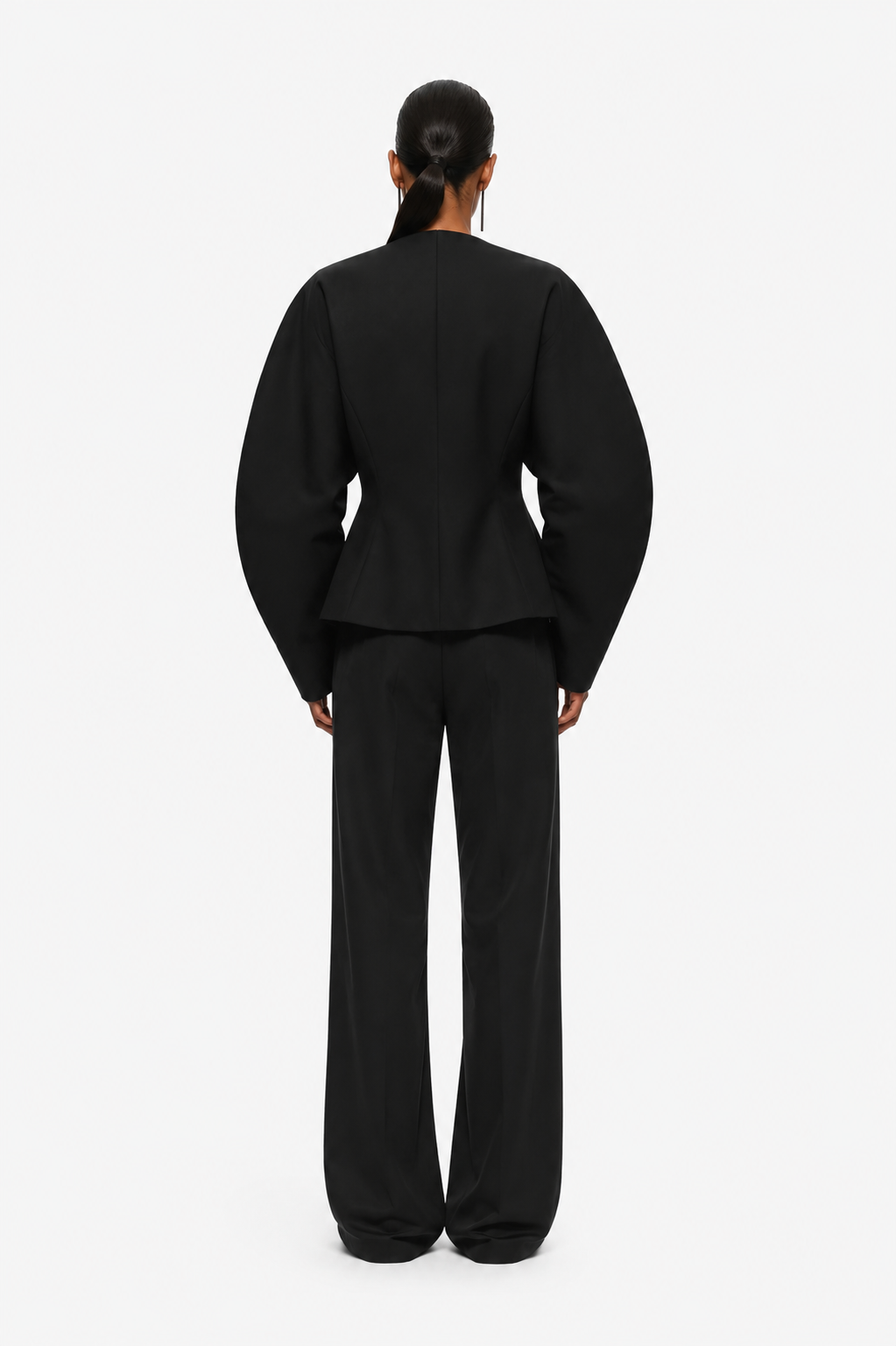Black blazer jacket back view with V-neck seam and long sleeves